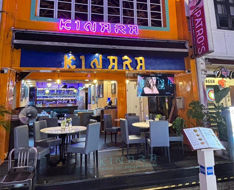 Traditional floral rangoli at restaurant entrance